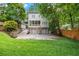 Spacious backyard with a two-car garage, basketball hoop, and lush green grass at 66 Mobile Ne Ave, Atlanta, GA 30305