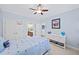 Bedroom boasts blue walls, a fan, closet, and a dresser at 66 Mobile Ne Ave, Atlanta, GA 30305