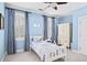 Charming bedroom with blue walls, white trim, a ceiling fan, and a cozy single bed at 66 Mobile Ne Ave, Atlanta, GA 30305