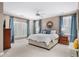 Comfortable bedroom with large windows and stylish curtains at 66 Mobile Ne Ave, Atlanta, GA 30305