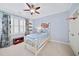 Bedroom with blue walls, white trim, and a ceiling fan at 66 Mobile Ne Ave, Atlanta, GA 30305