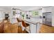 Modern kitchen with granite countertops, stainless steel appliances, and a breakfast bar with seating at 66 Mobile Ne Ave, Atlanta, GA 30305