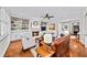 Cozy living room with built-in bookshelves, fireplace, and hardwood floors, perfect for entertaining at 66 Mobile Ne Ave, Atlanta, GA 30305