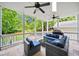 Covered patio with comfortable seating and ceiling fans, perfect for outdoor entertaining and relaxation at 66 Mobile Ne Ave, Atlanta, GA 30305