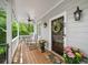 Inviting front porch with rocking chairs and potted flowers, perfect for enjoying the outdoors at 66 Mobile Ne Ave, Atlanta, GA 30305