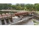 Aerial view of the Lake Peachtree bridge on a sunny day showcasing nature and clear water at 1240 Hayes Sq, Peachtree City, GA 30269
