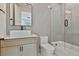 Charming bathroom with a herringbone tile wall, vessel sink and tub/shower combination at 1240 Hayes Sq, Peachtree City, GA 30269