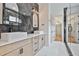 Elegant bathroom featuring dual sinks, stone countertops, and walk-in shower at 1240 Hayes Sq, Peachtree City, GA 30269