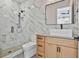 Bathroom featuring a walk-in shower with glass door, a vessel sink, and modern fixtures at 1240 Hayes Sq, Peachtree City, GA 30269