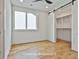 Bedroom with a double door entry to a large walk-in closet and large window at 1240 Hayes Sq, Peachtree City, GA 30269