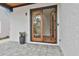 Covered front patio showing glass double-doors and a potted plant at 1240 Hayes Sq, Peachtree City, GA 30269