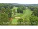 Aerial shot of a golf course with lush green fairways at 1240 Hayes Sq, Peachtree City, GA 30269