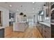 Spacious kitchen with a large island, stainless steel appliances, and modern pendant lighting at 1240 Hayes Sq, Peachtree City, GA 30269