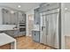 Kitchen featuring gray cabinets, stainless steel appliances, and quartz countertops at 1240 Hayes Sq, Peachtree City, GA 30269