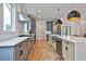 Gourmet kitchen with quartz countertops, stainless steel appliances, and designer fixtures at 1240 Hayes Sq, Peachtree City, GA 30269