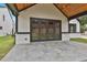 Covered outdoor patio with stylish stone flooring and a large folding glass door to the home at 1240 Hayes Sq, Peachtree City, GA 30269