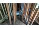 Unfinished bathroom showing exposed wall framing, a tub, and debris scattered on the floor at 1285 North Nw Ave, Atlanta, GA 30318