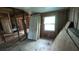 Bedroom renovation featuring exposed framing, unfinished walls and construction debris on the floor at 1285 North Nw Ave, Atlanta, GA 30318