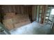 Bedroom undergoing construction, featuring bare walls, new framing and natural light from a window at 1285 North Nw Ave, Atlanta, GA 30318