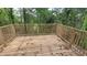 New wood deck with wood railing overlooks a densely wooded yard at 1285 North Nw Ave, Atlanta, GA 30318