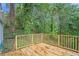 Wooden deck view featuring a lush, green backyard offering privacy and nature at 1285 North Nw Ave, Atlanta, GA 30318