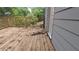 Wooden deck with railing, showing the exterior of the home with gray siding at 1285 North Nw Ave, Atlanta, GA 30318