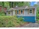 Side view of a charming home featuring rustic shutters and colorful foundation at 1285 North Nw Ave, Atlanta, GA 30318