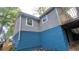 New house with gray siding and a blue foundation, showcasing a recent renovation at 1285 North Nw Ave, Atlanta, GA 30318