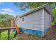 Exterior view of home with wooden deck, stairs and lush, green backyard at 1285 North Nw Ave, Atlanta, GA 30318