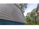 Close-up of the light gray siding, next to another home, showcasing modern construction at 1285 North Nw Ave, Atlanta, GA 30318
