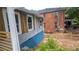 Exterior side view showing light gray siding and wood-look decorative shutters at 1285 North Nw Ave, Atlanta, GA 30318