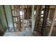 Hallway under renovation shows exposed wooden studs and beams ready for finishing touches at 1285 North Nw Ave, Atlanta, GA 30318