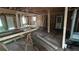 An unfinished interior with exposed beams, wall studs, and a tub, with natural light filtering through at 1285 North Nw Ave, Atlanta, GA 30318