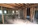 Unfinished interior with exposed wood framing and some windows providing natural light at 1285 North Nw Ave, Atlanta, GA 30318