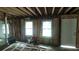 A renovation in progress showcases new windows and doorways in the unfinished space at 1285 North Nw Ave, Atlanta, GA 30318