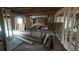 Living room in the process of renovation with exposed beams and construction materials lying around at 1285 North Nw Ave, Atlanta, GA 30318