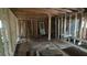Living room remodeling underway with unfinished walls, wood framing and new door installation visible at 1285 North Nw Ave, Atlanta, GA 30318