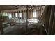 Living Room undergoing construction with exposed framing and natural light from multiple windows at 1285 North Nw Ave, Atlanta, GA 30318