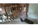 Living room under construction reveals exposed studs, wooden supports, new partition and an adjacent doorway at 1285 North Nw Ave, Atlanta, GA 30318