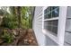 Exterior side view of the house near a hillside with trees at 1285 North Nw Ave, Atlanta, GA 30318