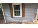 Close-up of a window with wood-look decorative shutters at 1285 North Nw Ave, Atlanta, GA 30318
