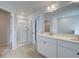 Bright bathroom with a glass shower, double sink vanity, and tile flooring at 504 Amethyst Way, Stockbridge, GA 30281