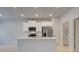 Stylish kitchen with quartz island, stainless appliances, and a pantry provides a great cooking and gathering space at 504 Amethyst Way, Stockbridge, GA 30281