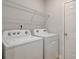 Laundry room featuring a Whirlpool washer and dryer at 504 Amethyst Way, Stockbridge, GA 30281