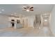Bright, open-concept living space with island kitchen, modern finishes, and access to stairway and entryway at 504 Amethyst Way, Stockbridge, GA 30281