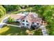 An aerial shot shows the home with an in-ground pool and patio, surrounded by lush greenery at 3222 Bay View Dr, Jonesboro, GA 30236