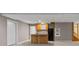 Finished basement with kitchenette, tile flooring, and neutral colors at 3222 Bay View Dr, Jonesboro, GA 30236