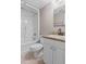 Bathroom with a shower-tub combination, white toilet, and granite-topped vanity at 3222 Bay View Dr, Jonesboro, GA 30236