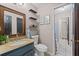 Updated bathroom with a granite countertop and a decorative wood-framed mirror at 3222 Bay View Dr, Jonesboro, GA 30236