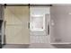 View of ensuite bathroom from main bedroom, including tiled floor and a soaking tub at 3222 Bay View Dr, Jonesboro, GA 30236